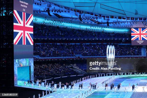 Flag bearers Eve Muirhead and Dave Ryding of Team Great Britain carry their flag during the Opening Ceremony of the Beijing 2022 Winter Olympics at...