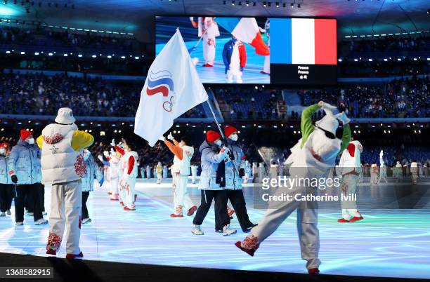 Flag bearers Olga Fatkulina and Vadim Shipachyov of Team ROC carry their flag during the Opening Ceremony of the Beijing 2022 Winter Olympics at the...
