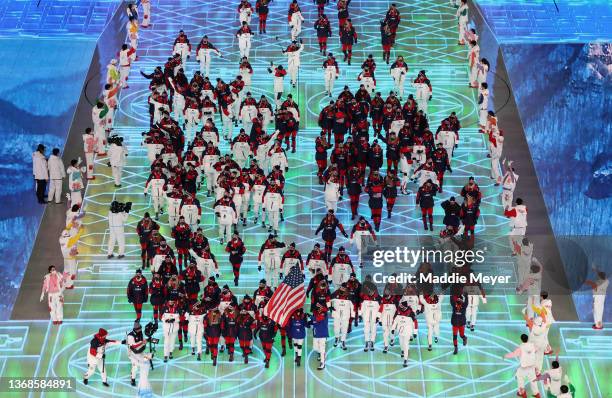 Flag bearers Brittany Bowe and John Shuster of Team United States lead the team during the Opening Ceremony of the Beijing 2022 Winter Olympics at...