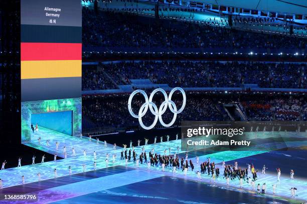 Flag bearers Francesco Friedrich and Claudia Pechstein of Team Germany carry their flag during the Opening Ceremony of the Beijing 2022 Winter...