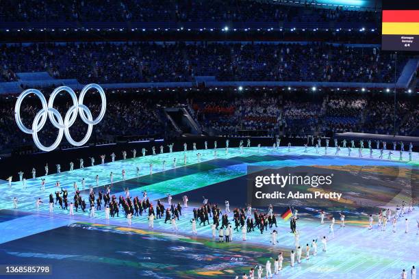 Flag bearers Francesco Friedrich and Claudia Pechstein of Team Germany carry their flag during the Opening Ceremony of the Beijing 2022 Winter...