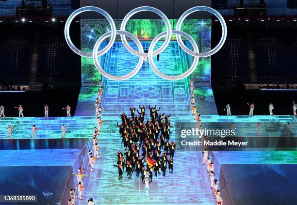 Flag bearers Francesco Friedrich and Claudia Pechstein of Team Germany carry their flag during the Opening Ceremony of the Beijing 2022 Winter...