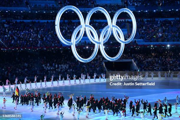 Flag bearers Francesco Friedrich and Claudia Pechstein of Team Germany carry their flag during the Opening Ceremony of the Beijing 2022 Winter...