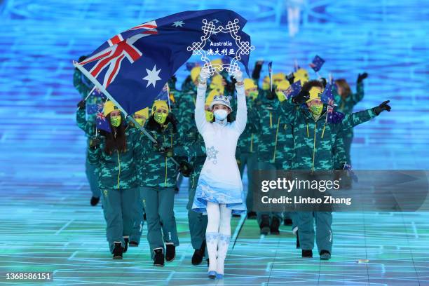 Flag bearers Brendan Kerry and Laura Peel of Team Australia carry their flag during the Opening Ceremony of the Beijing 2022 Winter Olympics at the...