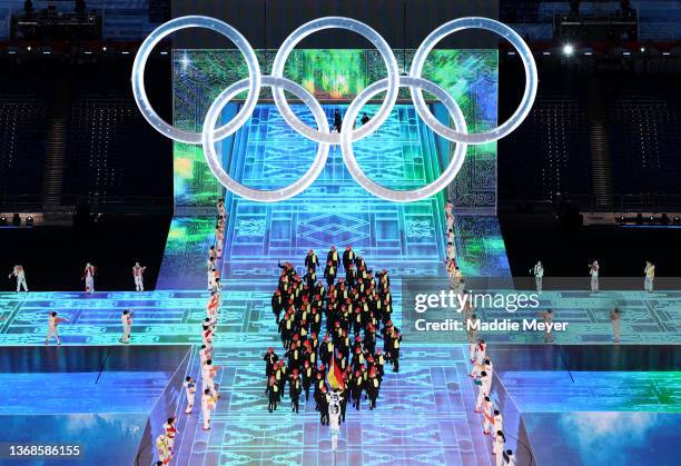 Flag bearers Francesco Friedrich and Claudia Pechstein of Team Germany carry their flag during the Opening Ceremony of the Beijing 2022 Winter...