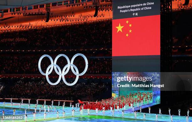 Flag bearers Tingyu Gao and Dan Zhao of Team China carry their flag during the Opening Ceremony of the Beijing 2022 Winter Olympics at the Beijing...