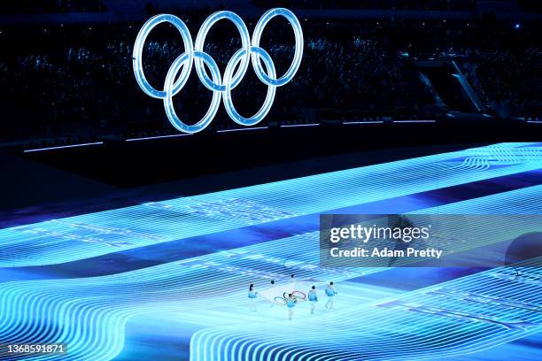 Zhihuan Luo, Hui Zhang, Jiajun Li, Xue Shen, Xiaopeng Han and Hong Zhang carry the Olympic Flag during the Opening Ceremony of the Beijing 2022...