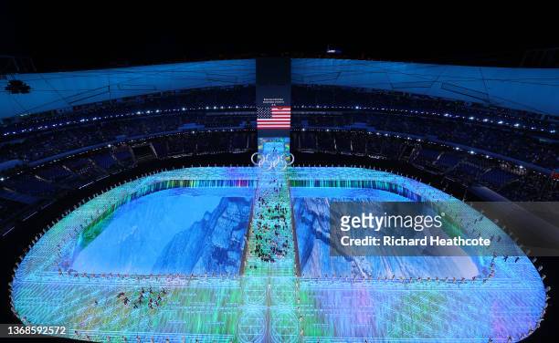 General view as flag bearers Brittany Bowe and John Shuster of Team United States lead their team out during the Opening Ceremony of the Beijing 2022...