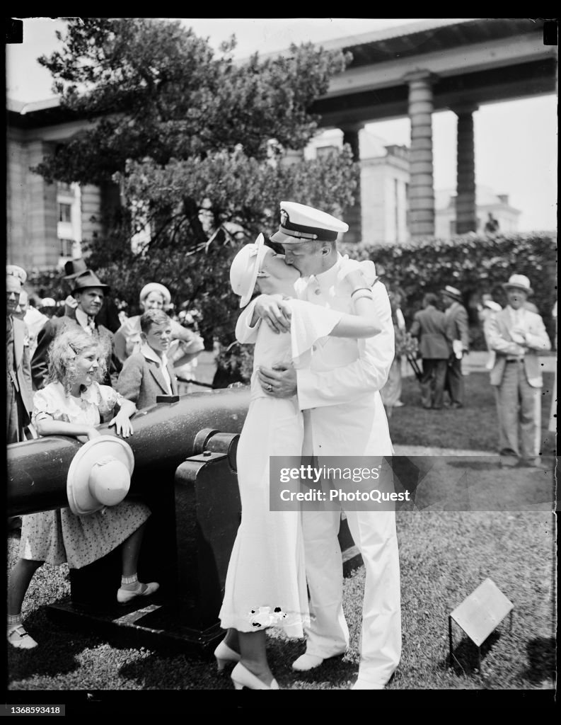 Naval Academy Graduate Kisses Woman