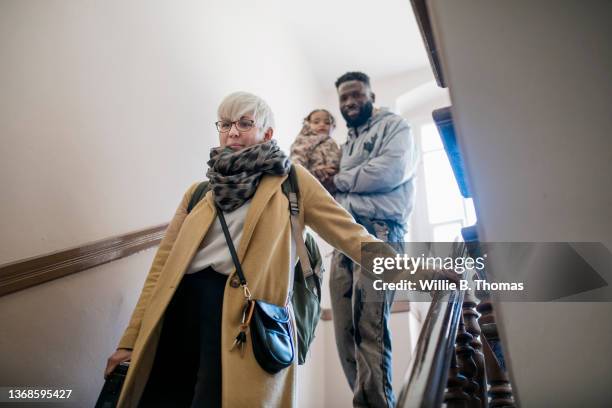 mixed race family heading out for the day - baby bag bildbanksfoton och bilder