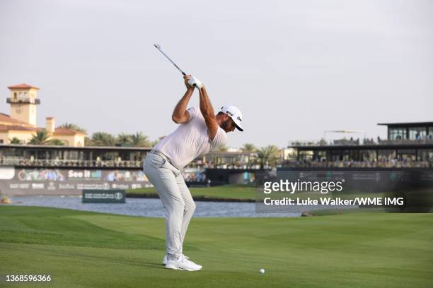 Dustin Johnson of the United States plays his second shot on the 18th hole during day two of the PIF Saudi International at Royal Greens Golf &...
