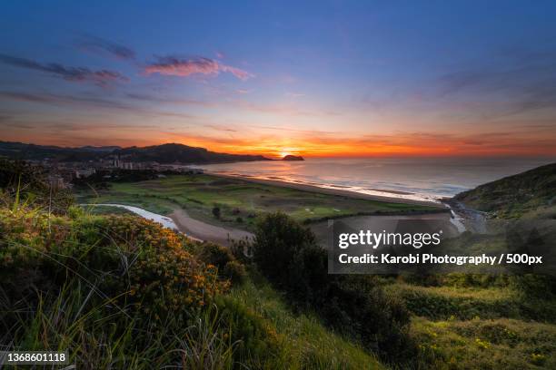 scenic view of landscape against sky during sunset,zarautz,gipuzkoa,spain - comunidade autónoma do país basco imagens e fotografias de stock