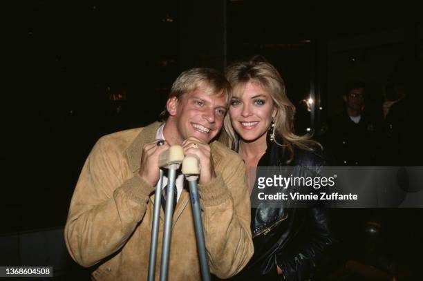 American swimmer Steve Lundquist and American actress Lydia Cornell attend the Beverly Hills after party which followed the premiere of 'Down and Out...
