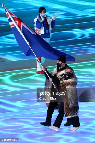 Flag bearers Finn Bilous and Alice Robinson of Team New Zealand lead the team during the Opening Ceremony of the Beijing 2022 Winter Olympics at the...