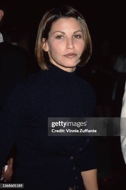 American actress Gina Gershon attends the Hollywood premiere of 'In & Out,' held at the Paramount Theatre in Los Angeles, California, 18th September...