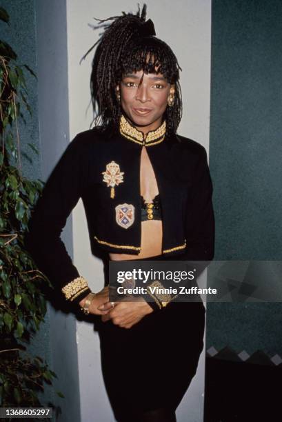 American singer and songwriter Siedah Garrett wearing a military-style jacket with gold brocade on the collar and cuffs, circa 1990.