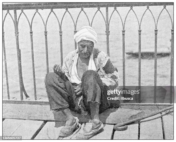 antique travel photographs of constantinople (istanbul): beggar - ottoman empire stock illustrations