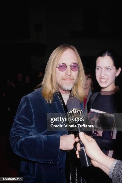 American singer, songwriter and musician Tom Petty attends the Burbank premiere of 'The Postman,' held at the Steven J Ross Theatre at Warner Bros...