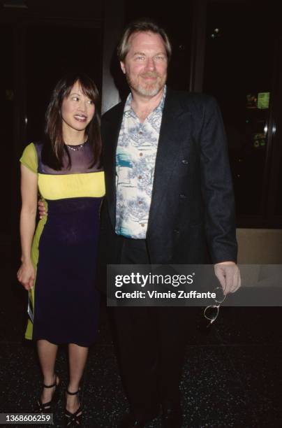 American actress Lauren Tom and American actor, musician and comedian Michael McKean attend the premiere of 'LA Confidential,' held at Mann's Chinese...