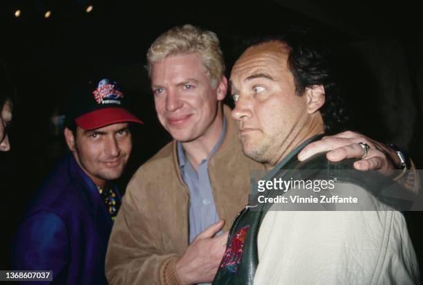 American actor Christopher McDonald, wearing a suede jacket with the 'Planet Hollywood' logo, and American actor and comedian Jim Belushi, wearing a...