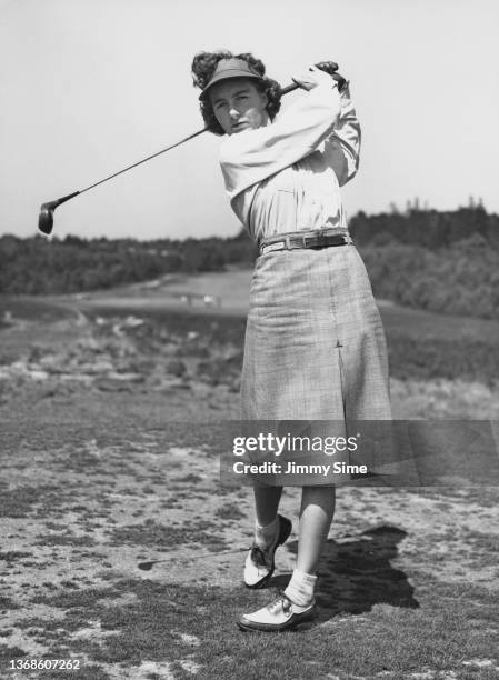 Dorothy Kielty of the United States and a member of the United States Curtis Cup team tees off during a practice round on 15th May 1948 at the...