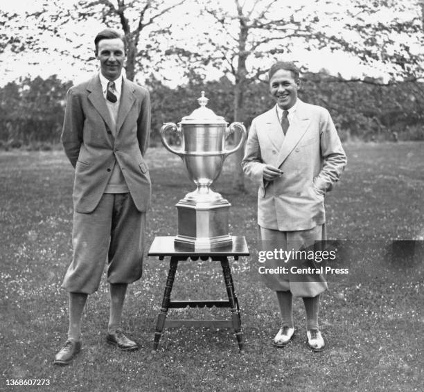 Roger Wethered team captain for Great Britain and Ireland poses with the Walker Cup trophy alongside opposing Bobby Jones team captain for the United...