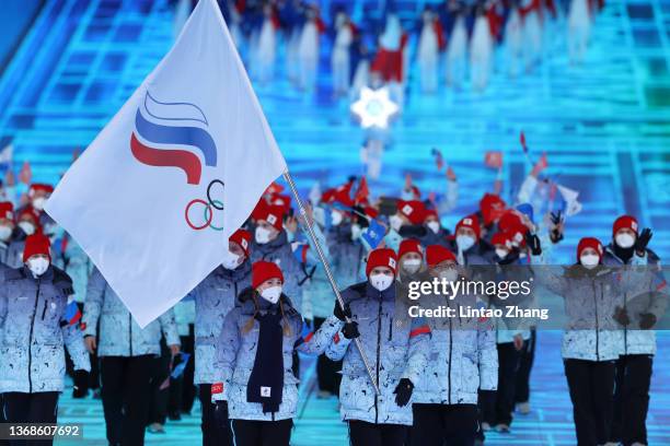 Flag bearers Olga Fatkulina and Vadim Shipachyov of Team ROC carry their flag during the Opening Ceremony of the Beijing 2022 Winter Olympics at the...