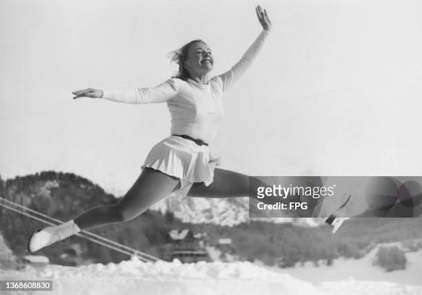 American figure skater Gretchen Merrill on the ice as she prepares her routine for the 1948 Winter Olympics in St Moritz, Switzerland, February 1948.
