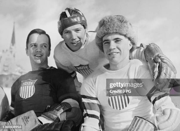 Three players of the USA 1948 Winter Olympic ice hockey team during a break in training at an ice rink ahead of the 1948 Winter Olympic Games, held...