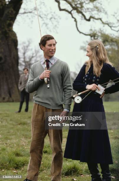 British Royal Charles, Prince of Wales and his girlfriend, Jane Ward, assistant manager of the Guards Polo Club, during a fly fishing competition at...