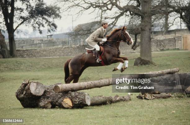 British Royal Charles, Prince of Wales on horseback takes a jump as he exercises his horse at the Badminton Horse Trials, in Badminton Park in...