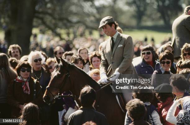 British Royal Charles, Prince of Wales on horseback among a crowd at the Badminton Horse Trials, in Badminton Park in Badminton, Gloucestershire,...