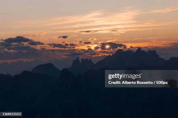 scenic view of silhouette of mountains against sky during sunset - rossetto stock pictures, royalty-free photos & images