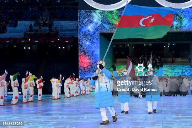 Flag bearer Vladimir Litvinstev of Team Azerbaijan leads their team during the Opening Ceremony of the Beijing 2022 Winter Olympics at the Beijing...