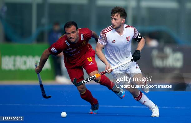 Zachary Wallace of England runs with the ball past Alvaro Iglesias of Spain during the Men's FIH Field Hockey Pro League match between Spain and...