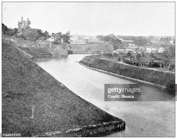 antique travel photographs of japan: moat around the palace, tokyo - tokyo palace stock illustrations