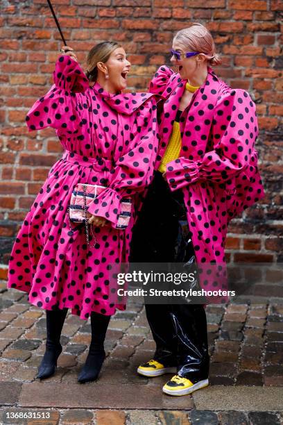 Influencer Janka Polliani wearing a pink coat with black dots by Balenciaga, black boots by by Balenciaga and a rose, black and white bag by Chanel...