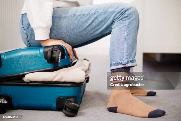 preparation travel suitcase at home - woman stuck floor stock pictures, royalty-free photos & images