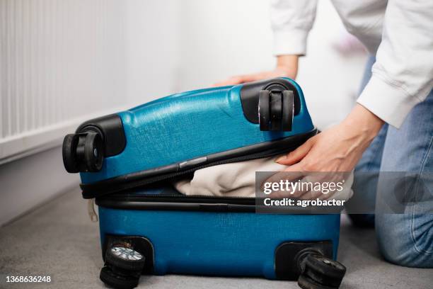 preparation travel suitcase at home - woman stuck floor stock pictures, royalty-free photos & images
