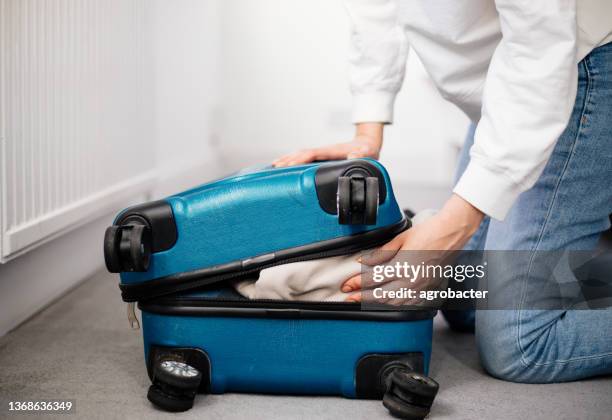 preparation travel suitcase at home - woman stuck floor stock pictures, royalty-free photos & images