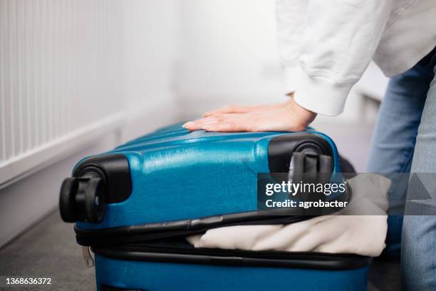 preparation travel suitcase at home - woman stuck floor stock pictures, royalty-free photos & images