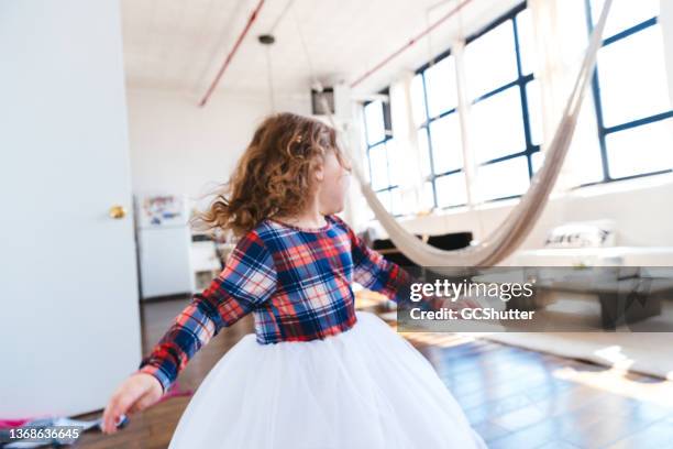 baby girl wearing tutu dancing with joy - child support stock pictures, royalty-free photos & images