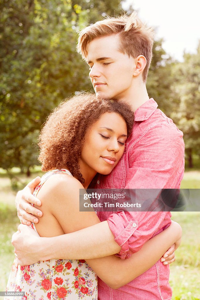 Young couple hugging.