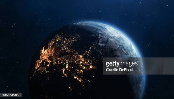 planet earth seen from space. city lights on the dark side - europa kontinent stock-fotos und bilder