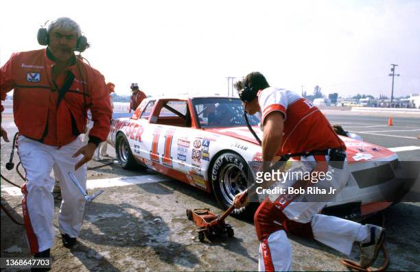Crew Chief Junior Johnson as NASCAR racer Darrell Waltrip car during a pit stop during the Winston Western 500 at Riverside Speedway on way to...