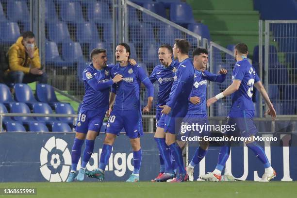 Enes Unal of Getafe CF celebrates scoring their opening goal with teammates during the LaLiga Santander match between Getafe CF and Levante UD at...