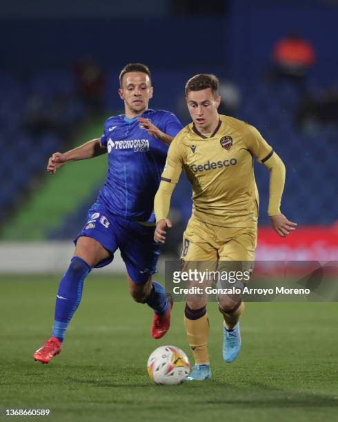 Jorge de Frutos of Levante UD competes for the ball with Nemanja Maksimovic of Getafe CF during the LaLiga Santander match between Getafe CF and...