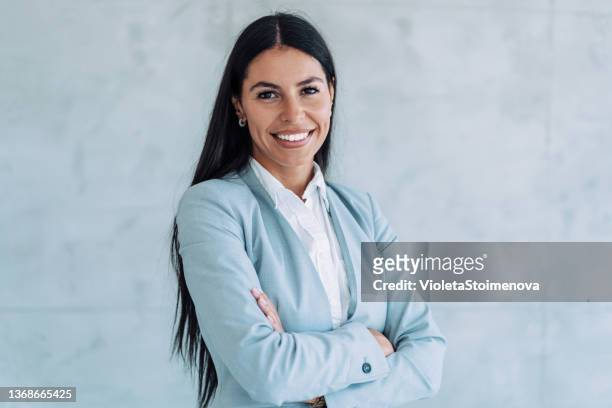 confident businesswoman in modern office. - marketing director stock pictures, royalty-free photos & images