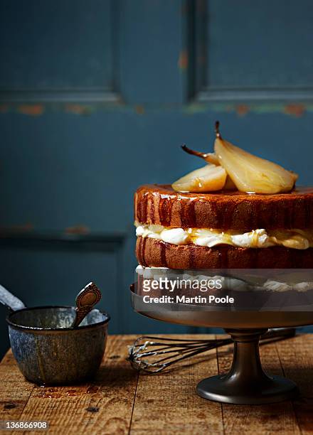 poached pear and cream layered cake - pear stock-fotos und bilder