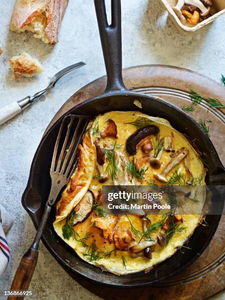 wild mushroom omelette in pan - french culture stock pictures, royalty-free photos & images
